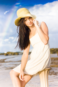 Young Woman Relaxing By The Sea