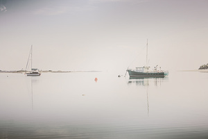 Vintage photo of a fishing boat anchored at dusk
