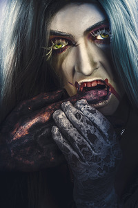 Dark halloween horror portrait. Creepy vampire