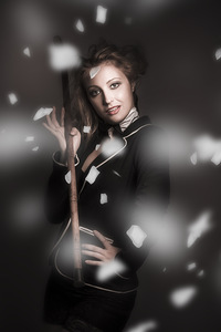 Beautiful vintage girl dancing with flower petals