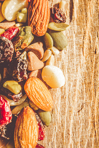 Mixed nuts on wooden background