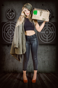 Army pinup girl at rifle range. Bullet proof