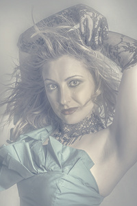 Mysterious young model dancing in vintage fashion 