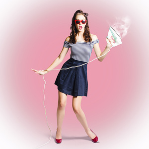Brunette pin-up housewife with iron
