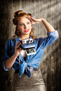 Young Retro Woman Holding Instant Camera