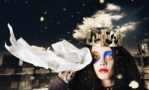 Crying fairytale queen wiping tears with tissue