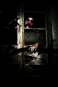 Scary Clown Clawing Window