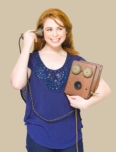 Woman Listening On A Vintage Wooden Box Telephone