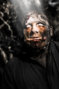 Horror zombie with finger food. Bad taste