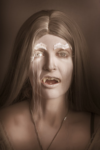 Vintage halloween portrait. Gothic vampire girl