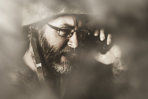 Vintage army soldier with modern mobile technology