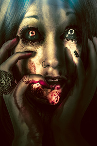 Dark scary female face expressing bloody fear