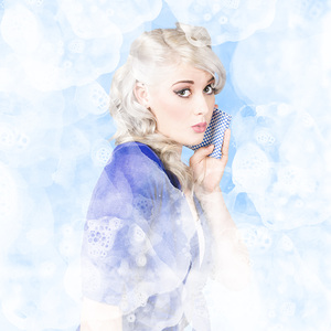 Gorgeous young woman cleaning in pinup style