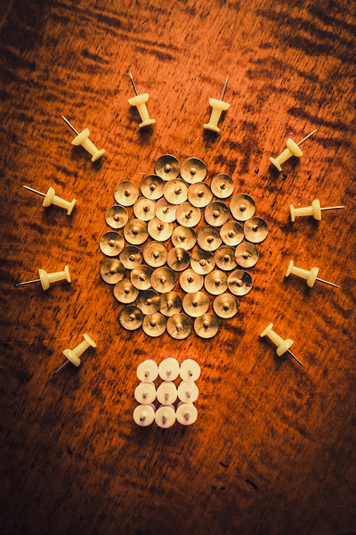 Pushpins arranged in light bulb icon Print
