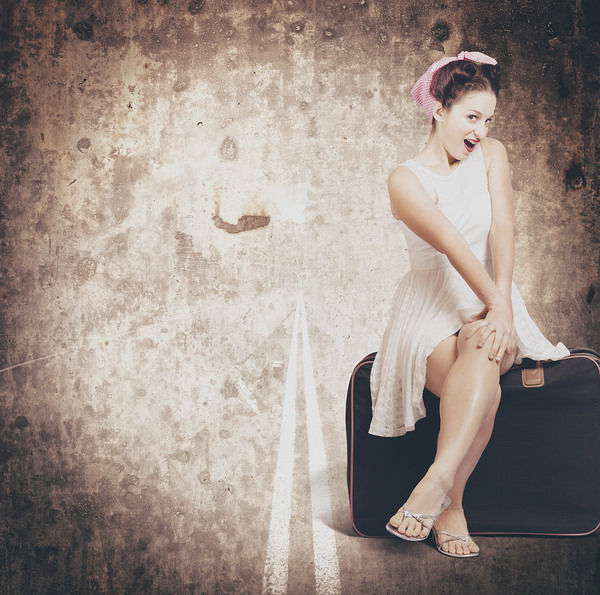 Young hitchhiking pin-up woman on vintage suitcase Print