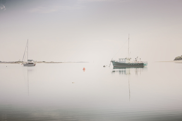 Vintage photo of a fishing boat anchored at dusk Print