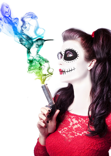 Sugar skull girl blowing on smoking gun Print