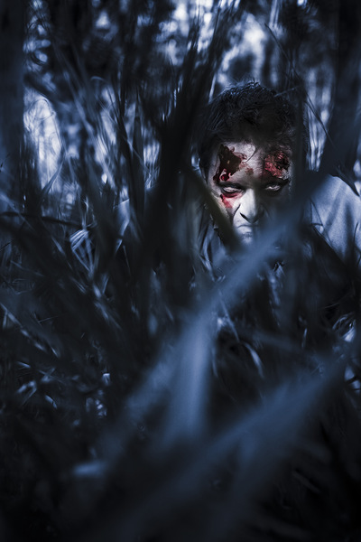 Evil man hiding in silence at dark forest  Print