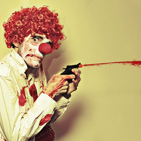 Creepy Manic Clown Shooting Blood From Cap Gun Print