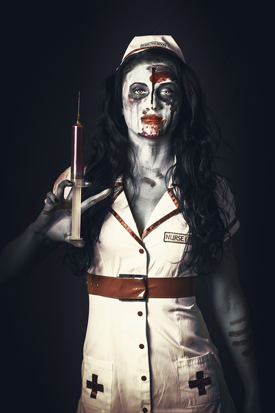 Zombie nurse holding bloody euthanasia syringe Print