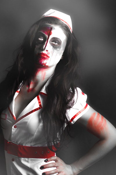 Scary zombie nurse with facial wounds Print