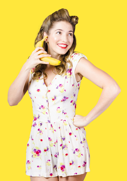 Retro pin up girl chatting on banana telephone Print