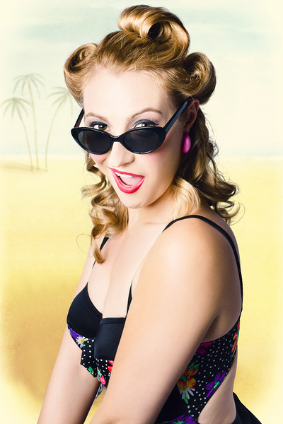 Surprised pinup girl on tropical beach background Print