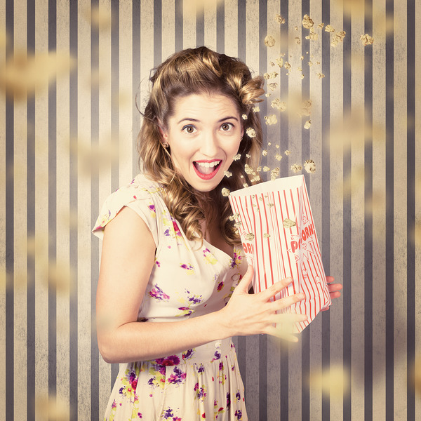 Young girl at the cinema watching halloween movie Print
