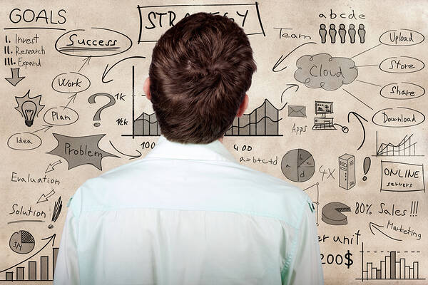 Creative businessman looking to plan business idea Print