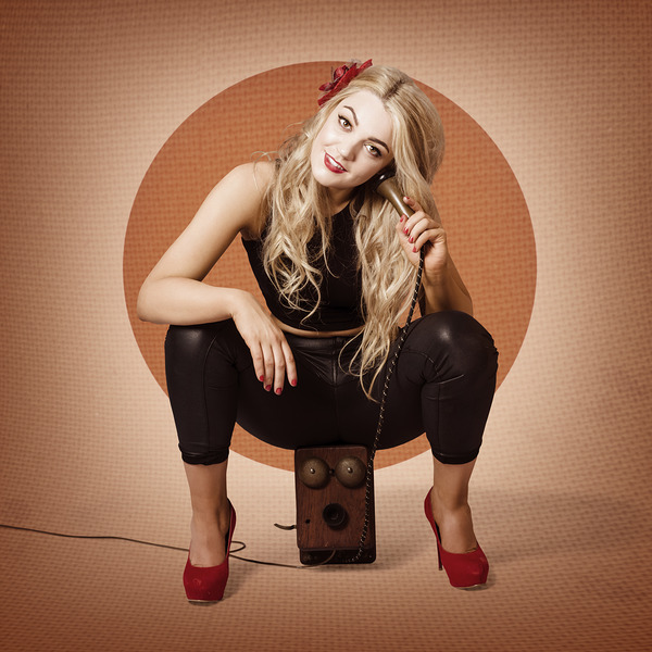 Happy pin up girl talking on retro box telephone Print