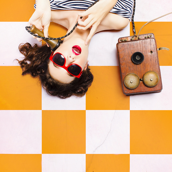 Pin-up beauty decision making on old phone Print