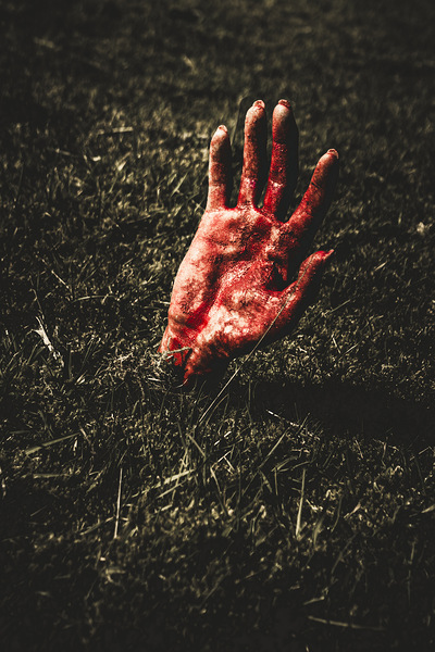 Zombie rising from a shallow grave Print