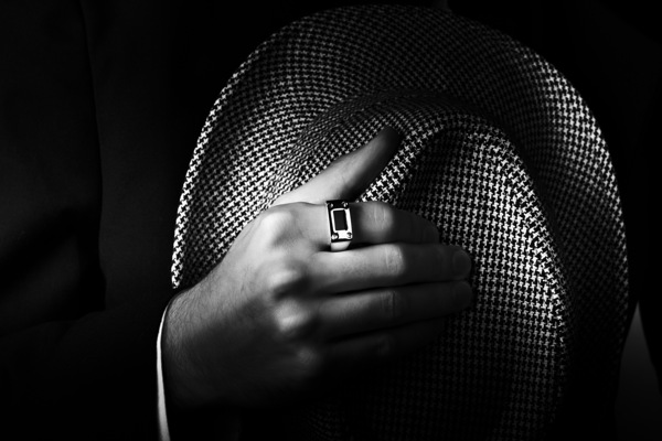 Close-up shot of a male ring hand holding hat Print