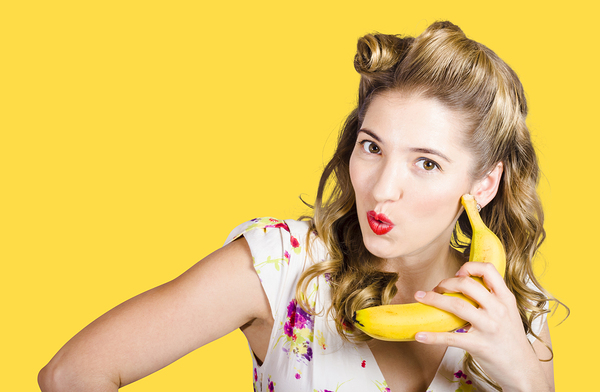Pinup woman ordering organic fruit on banana phone Print