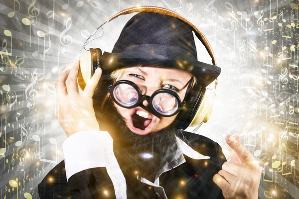 Rock man with beard listens to music on earphones Print