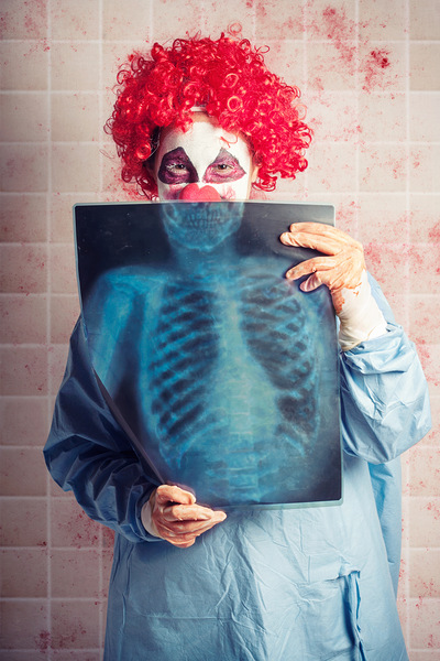 Scary clown peeking behind x-ray. Funny bones Print