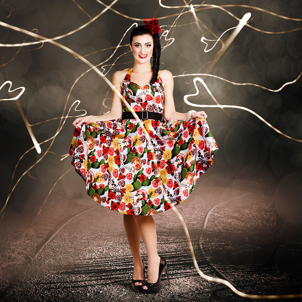 Woman dancing in colorful floral dress outdoor Print