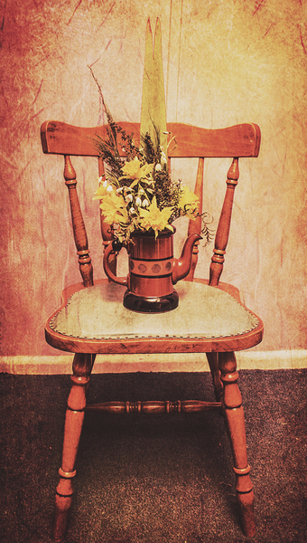 Decorated flower bunch on old wooden chair Print