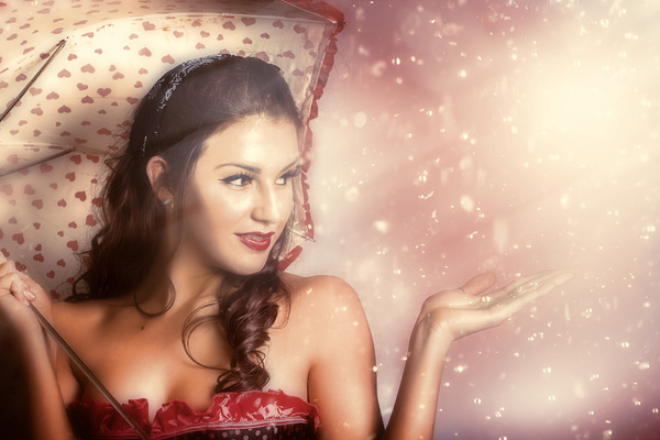 Beautiful woman catching rain in summer sun shower Print