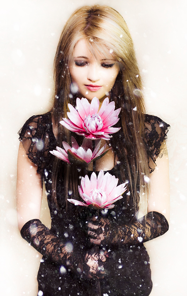 Beautiful young woman holding a delicate flower Print