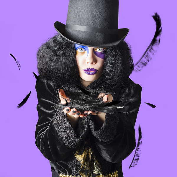 Magician blowing feathers Print