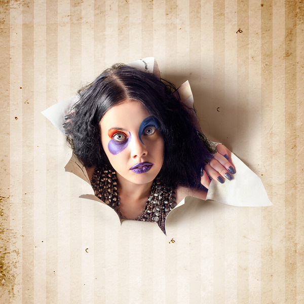 Beautiful female jester breaking out of wallpaper Print