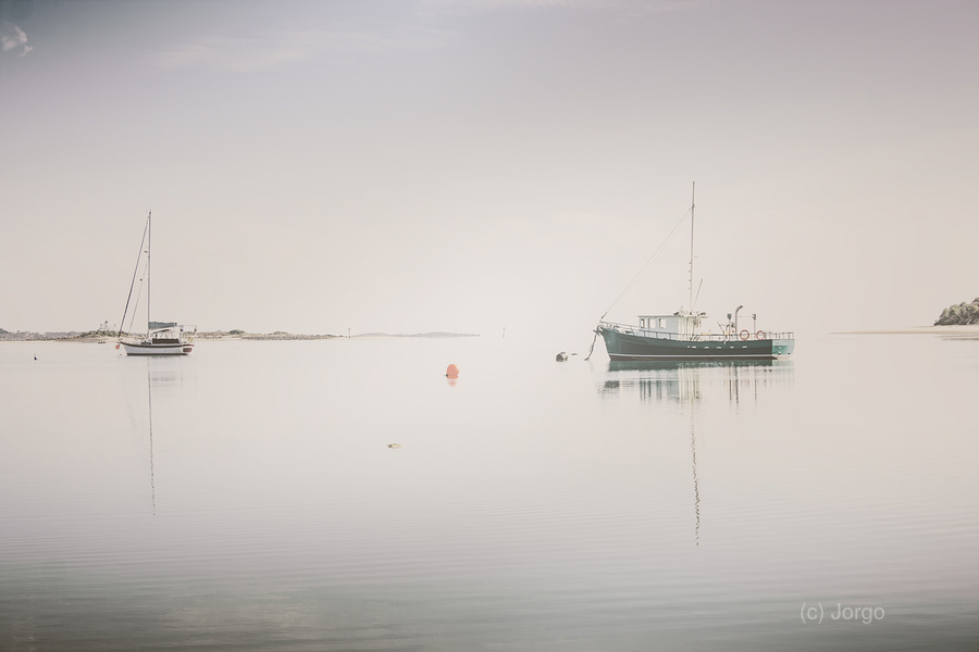 Vintage photo of a fishing boat anchored at dusk  Print