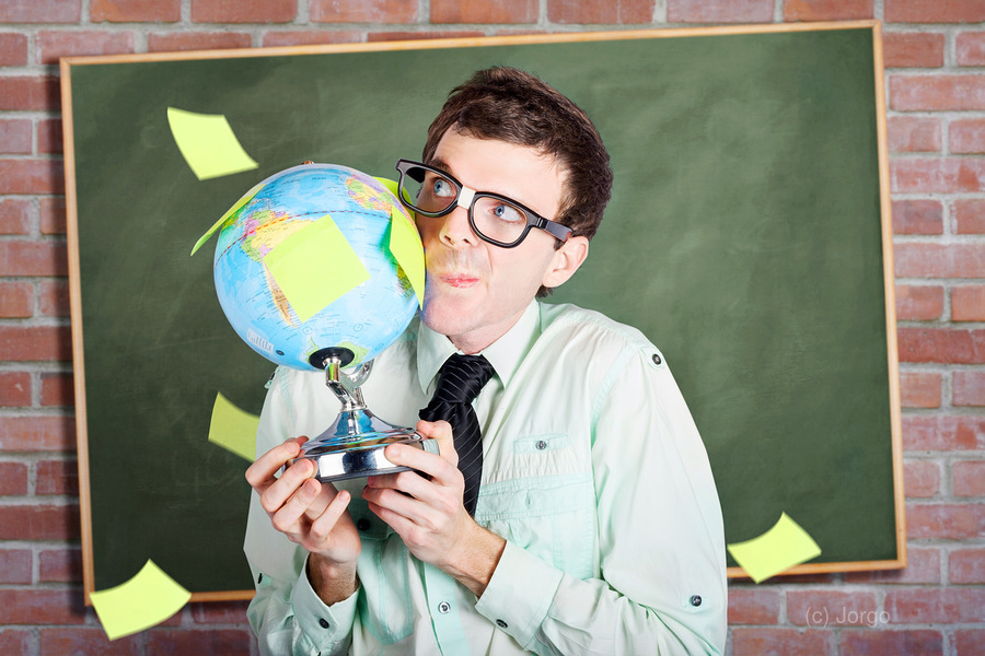 Nerd man holding earth world globe in classroom  Print