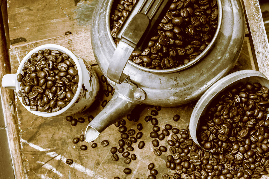 Roasted coffee beans in kettle and cup  Print