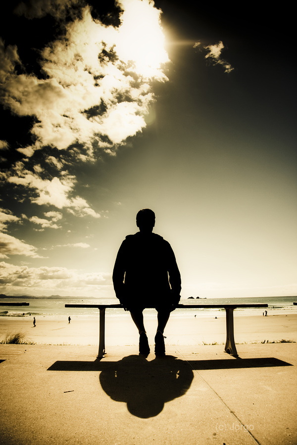 Young Man In Silhouette Sitting In The Sun  Print