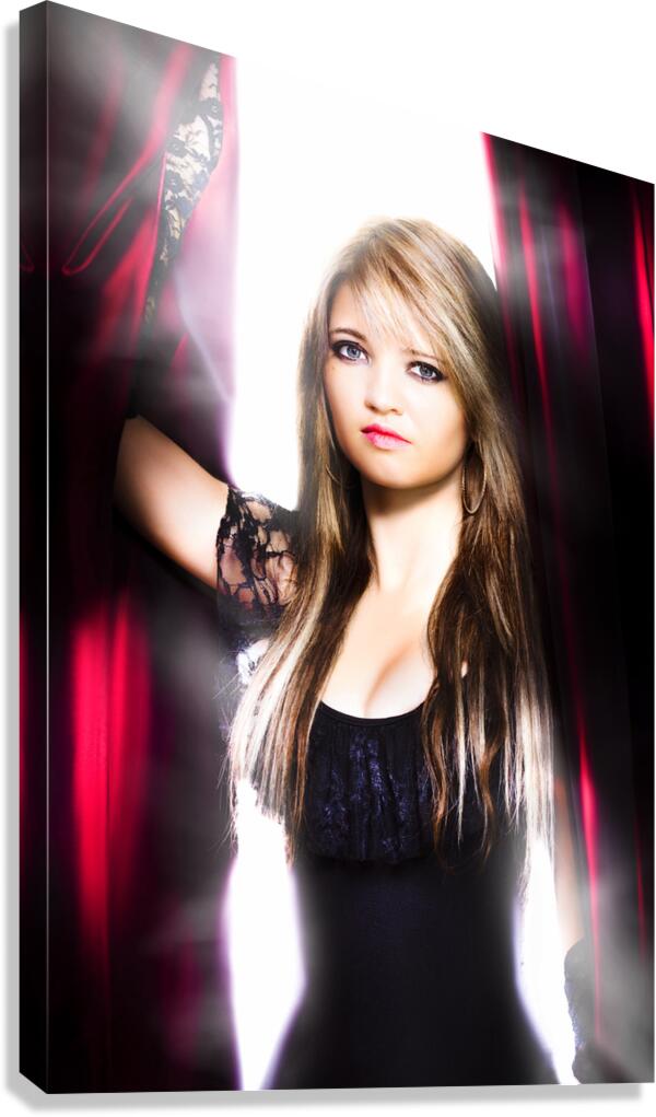 Female performer behind the stage curtain light Canvas Print