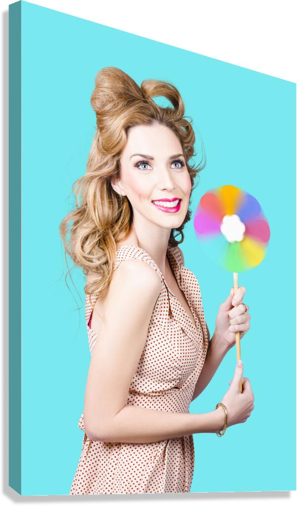 Blonde girl holding windmill fan. Natural energy Canvas Print