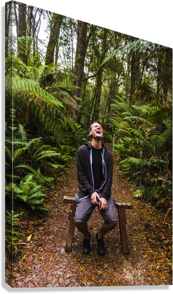 Travel man laughing in Tasmania rainforest Canvas Print
