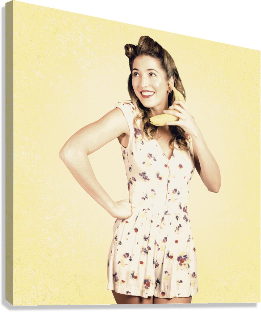 Funny pin-up model in conversation on banana phone Canvas Print